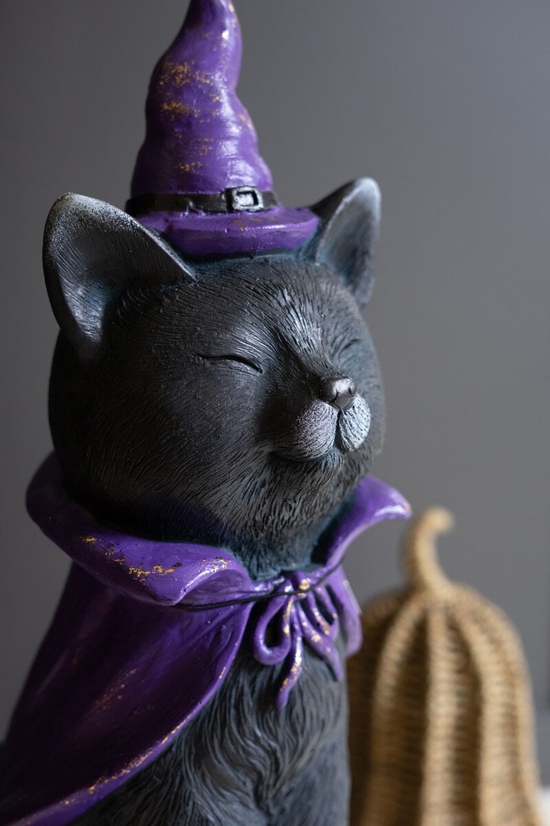Two-foot black cat Halloween figurine with purple hat and cape