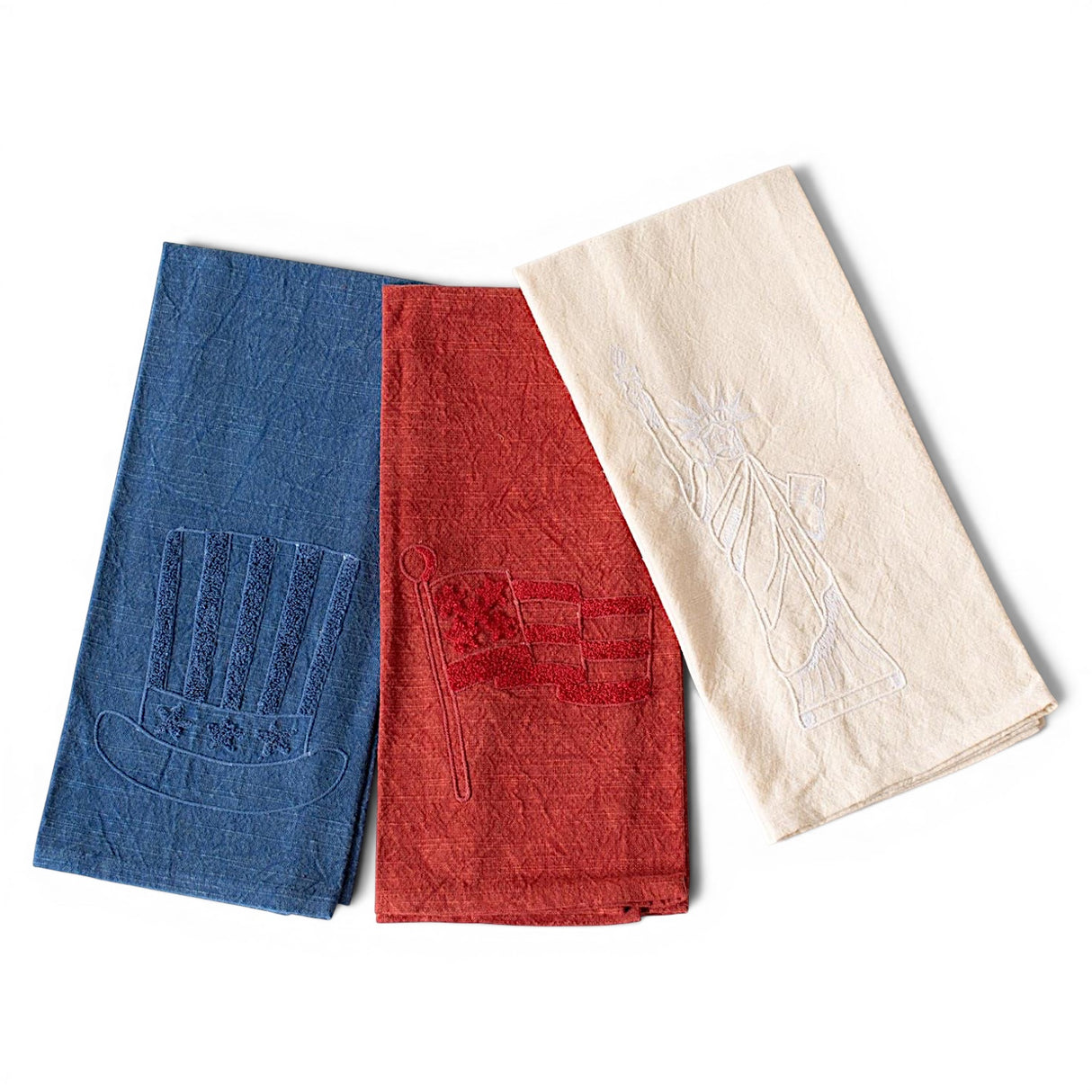 Patriotic embroidered stonewashed cotton tea towels with American flag, Uncle Sam hat, and Statue of Liberty designs
