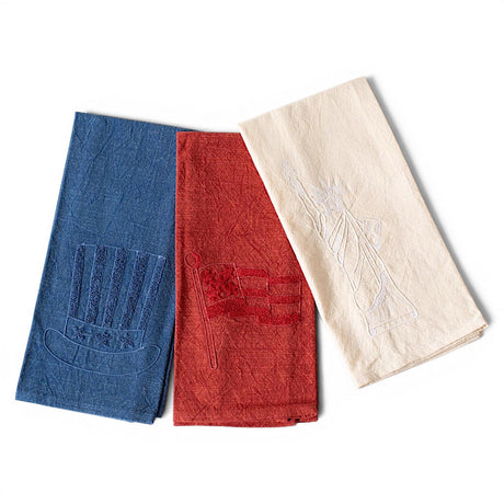 Patriotic embroidered stonewashed cotton tea towels with American flag, Uncle Sam hat, and Statue of Liberty designs
