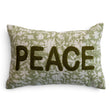 Green and natural floral lumbar pillow with raised olive-green PEACE lettering and hand-embroidered Kantha stitching
