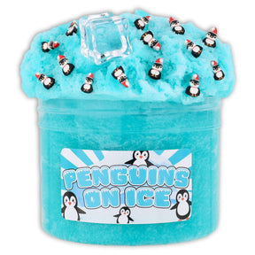 Teal icee slime with penguin fimos, ice cube charms, and snowflake topper in clear container