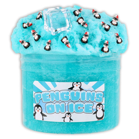Teal icee slime with penguin fimos, ice cube charms, and snowflake topper in clear container