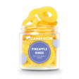 Clear cup filled with yellow pineapple ring gummies, labeled Pineapple Rings with tart and chewy flavor description