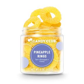 Clear cup filled with yellow pineapple ring gummies, labeled Pineapple Rings with tart and chewy flavor description