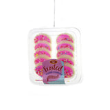 Pink frosted sugar cookies ornament with colorful sprinkles in clear tray