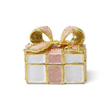Gift shaped enameled metal trinket box with white panels, a pink bow, gold-finish trim, and jewel accents.