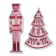 Pink, red, and white stoneware plates shaped like a nutcracker and Christmas tree