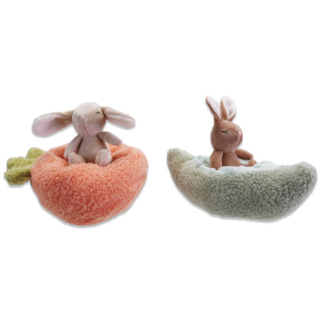 soft plush bunny toy sitting in cozy pod shaped bed