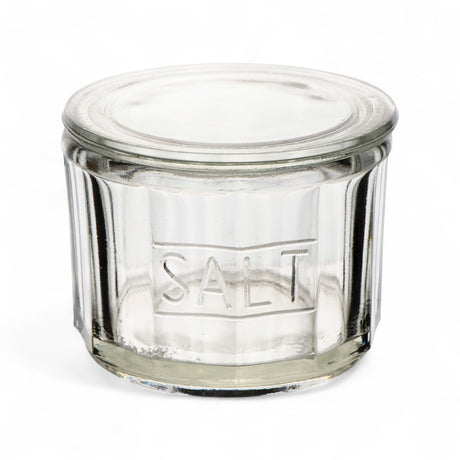 Clear pressed glass salt cellar with lid and embossed SALT lettering, 4.5 by 3.5 inches