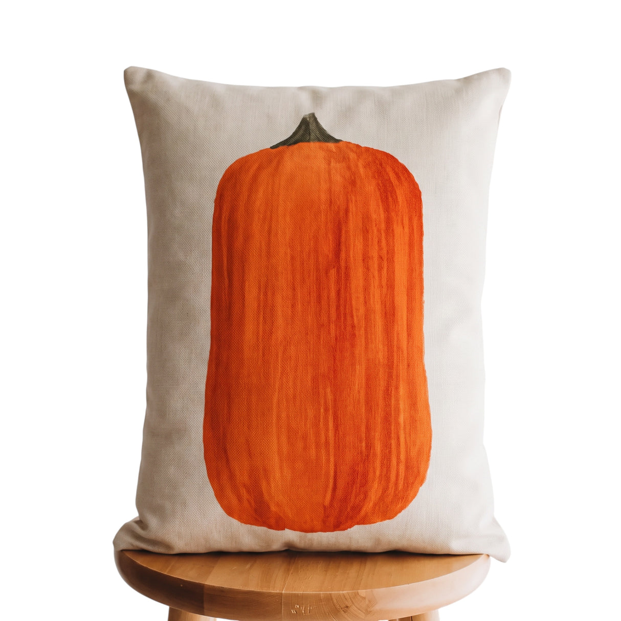 Primitive 12 x 18 upright orange pumpkin lumbar pillow with distressed artwork on a neutral background