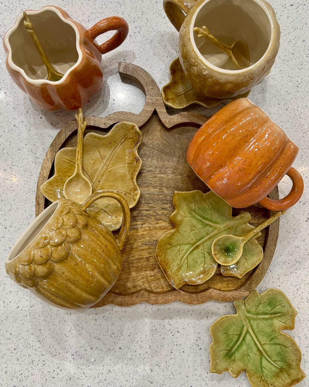 Pumpkin and acorn shaped ceramic mugs with leaf saucers and spoons for fall