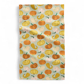Patterned fabric with pumpkins and gourds tea towel