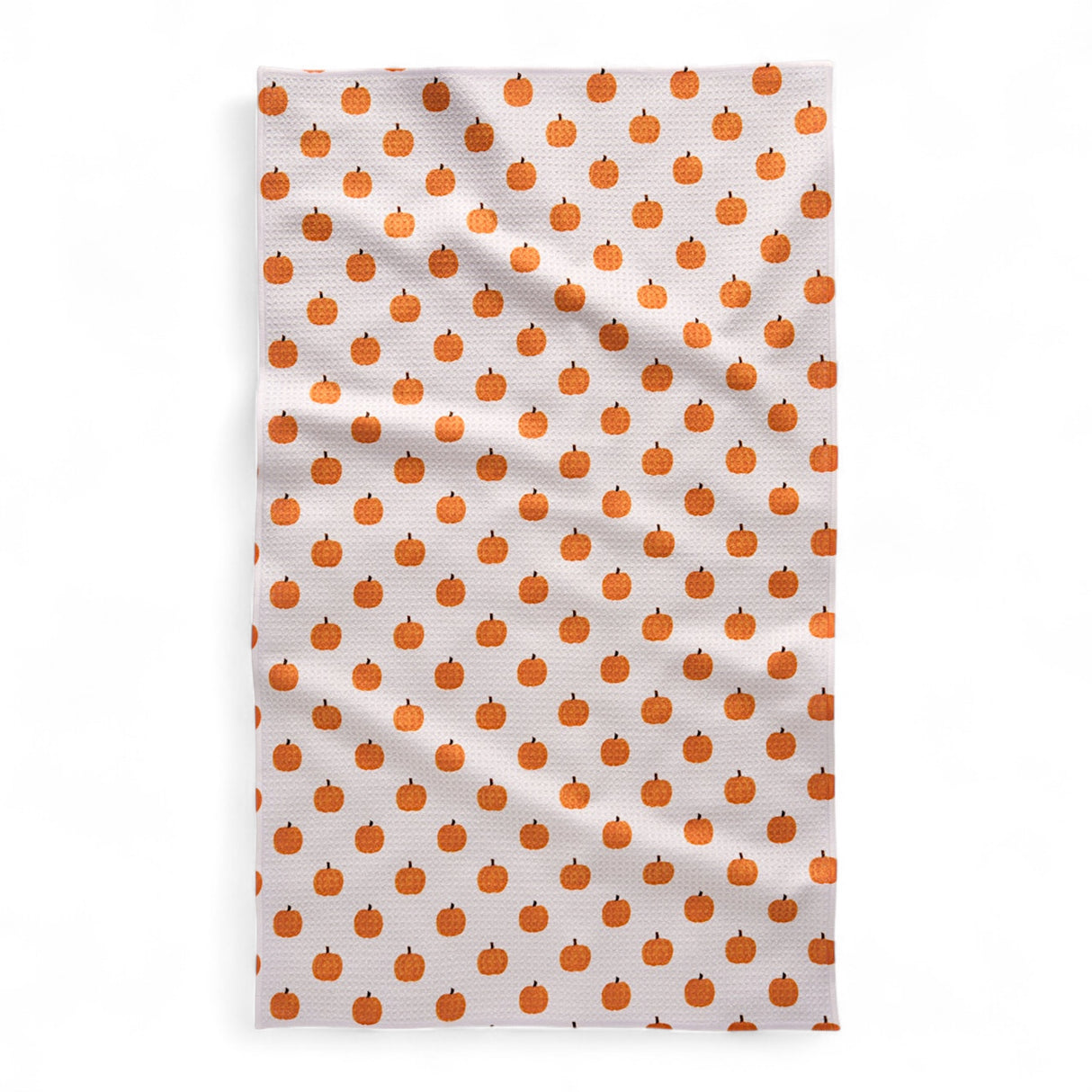 Tea towel with orange pumpkin pattern on a white background