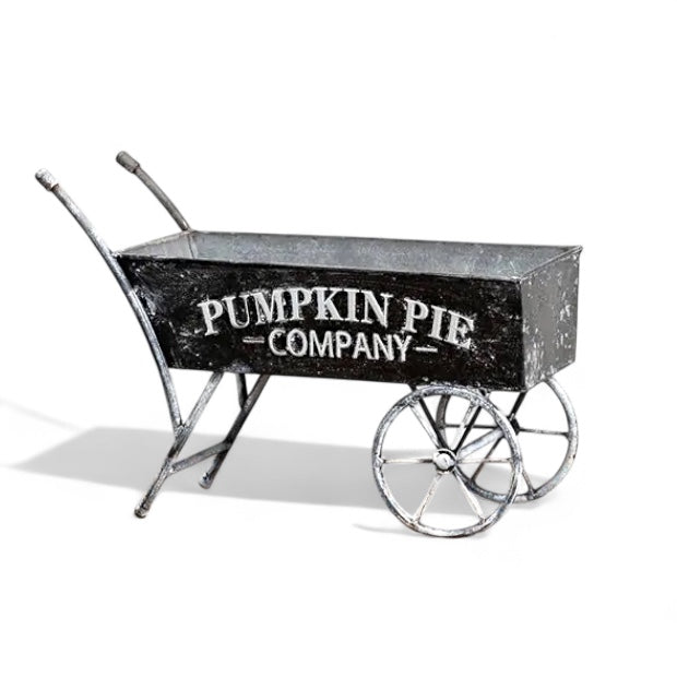 Black metal decorative wheelbarrow with “Pumpkin Pie Company” text for farmhouse fall décor