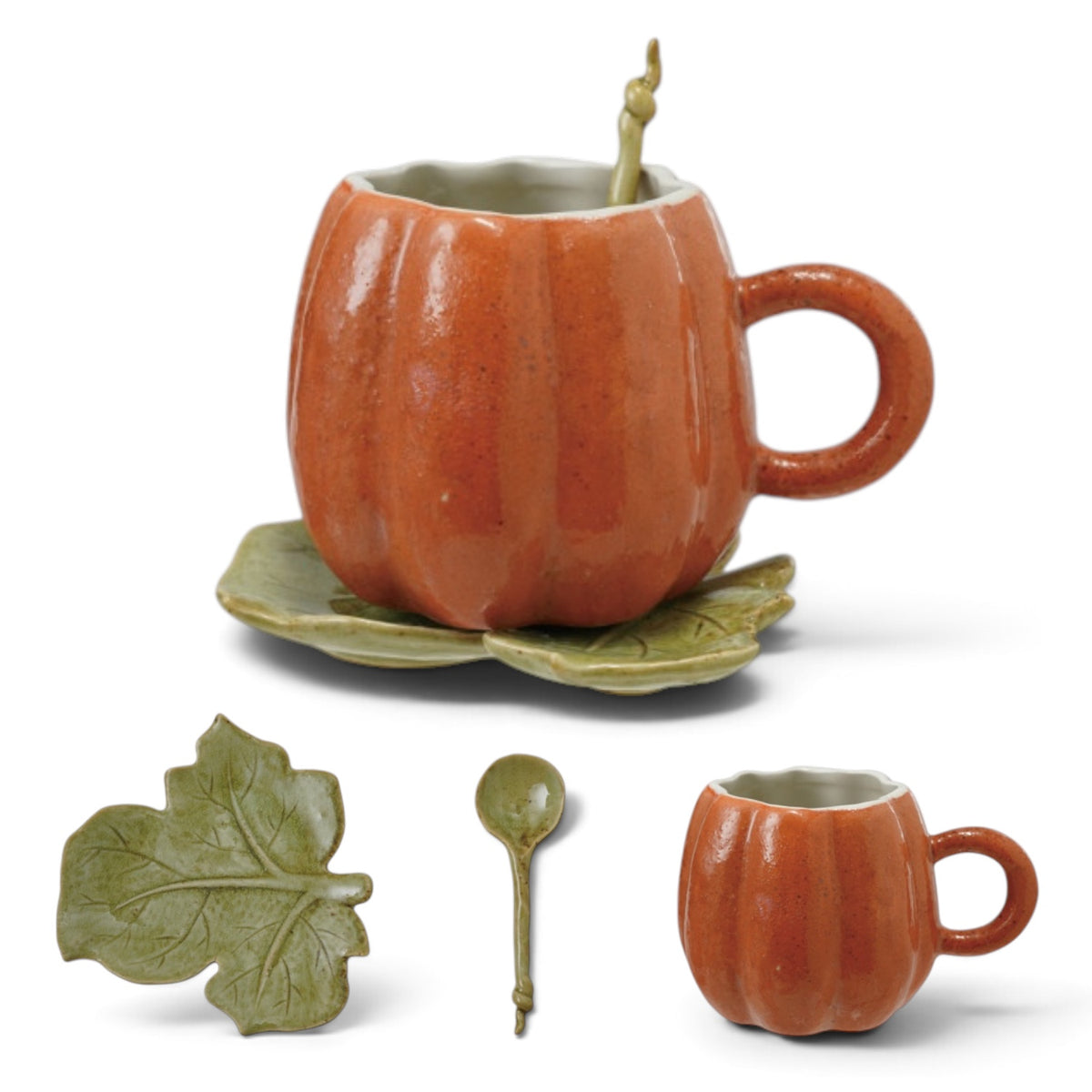 Orange pumpkin shaped ceramic mug with green leaf saucer and spoon for fall