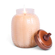 Pumpkin Swirl candle by A Cheerful Giver in a textured glass pumpkin jar with pale wax and a copper-toned pumpkin-stem lid.