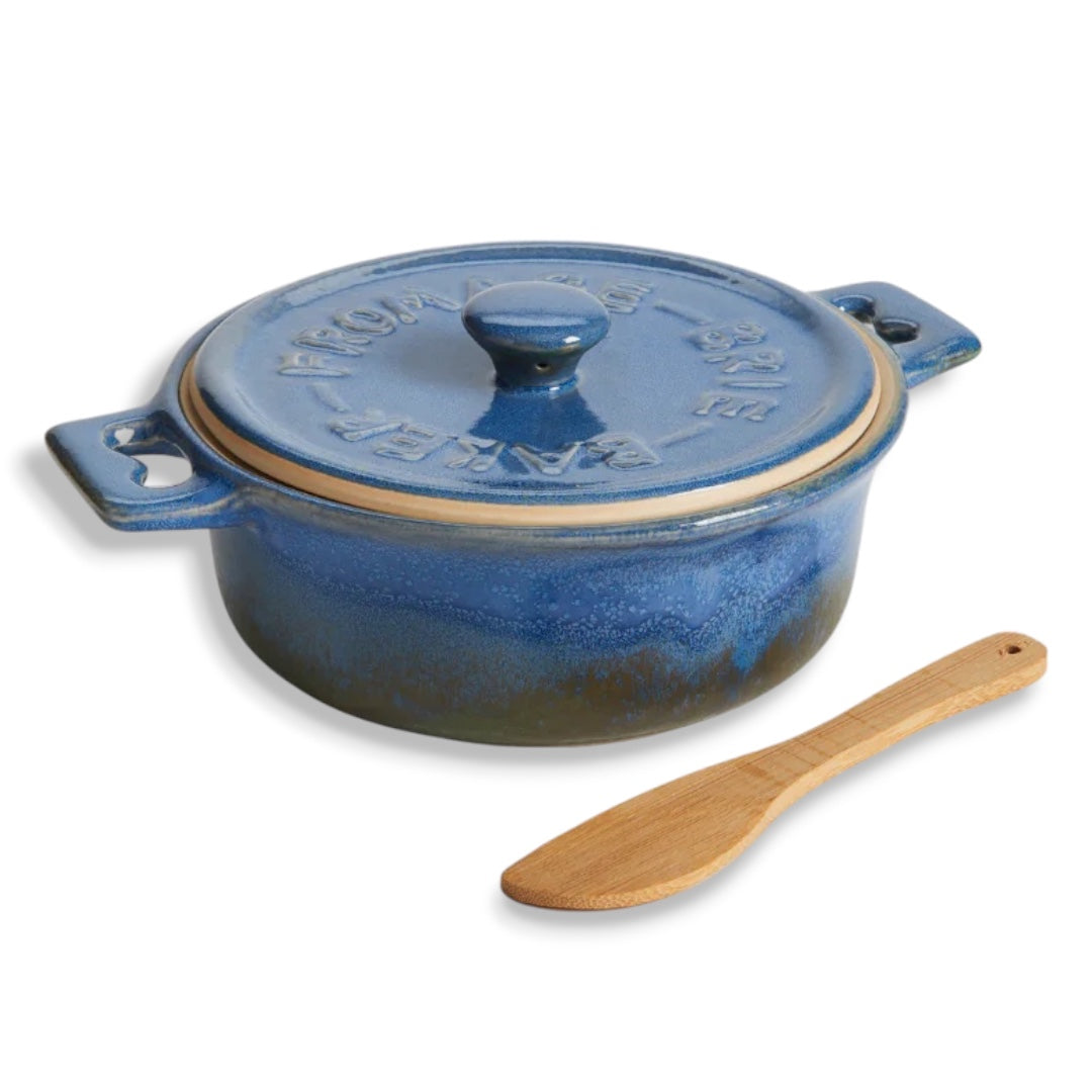 Blue reactive glaze stoneware brie baker with lid, side handles, and bamboo spreader for serving warm cheese