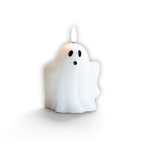 White real wax LED ghost candle with black face and six-hour timer for Halloween décor