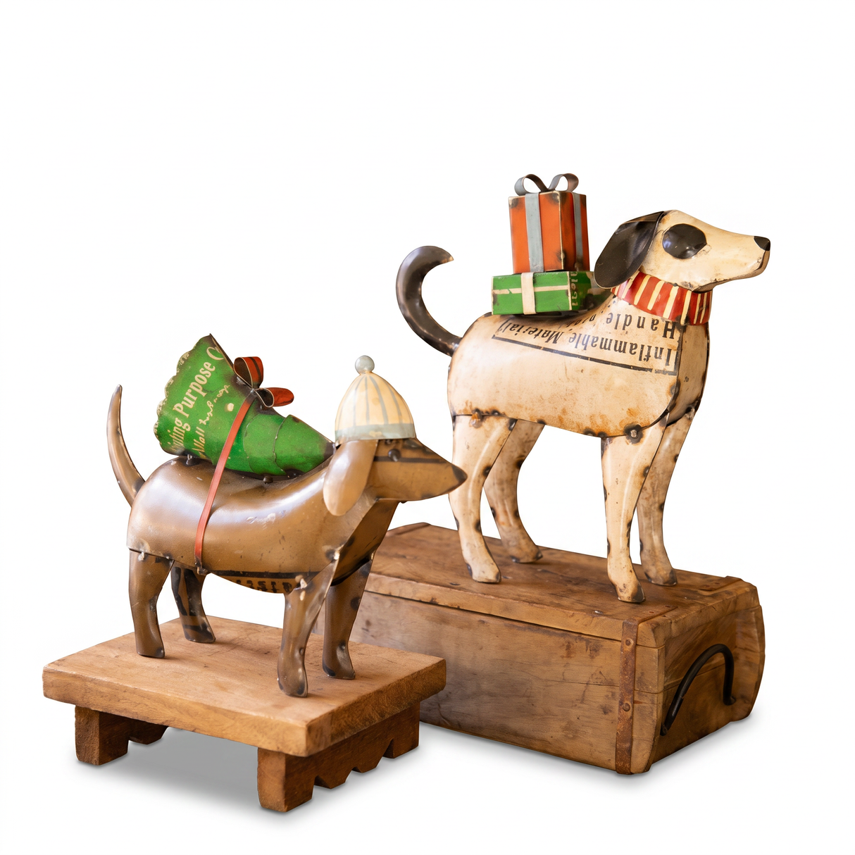 Handcrafted recycled metal Christmas dog decorations carrying gifts and Christmas tree for rustic holiday home décor.