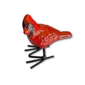 red cardinal made of cast iron