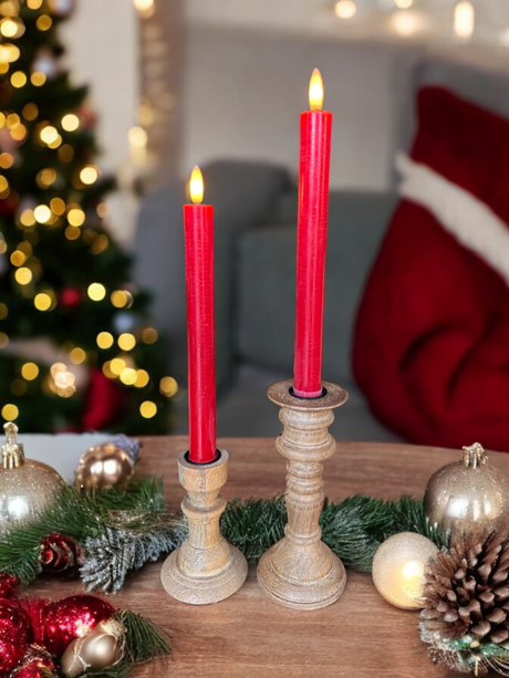 red 3D flame taper candles on a Christmas table