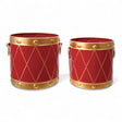 Two red and gold metal drum-shaped buckets with handles