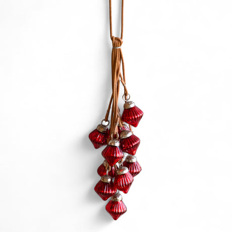 Cluster of ten red mercury glass drop ornaments on leather cord, 13 inches long