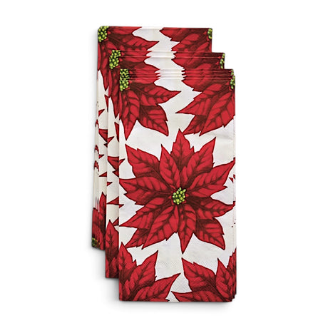 Cream paper napkins printed with red poinsettias and green centers, shown packaged beside a view of the repeating floral pattern