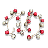 A garland of red and silver embossed glass ornaments with bronze toppers, tied with jute.