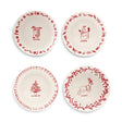  Four white ceramic plates with red stockings, snowman, Christmas tree, and reindeer illustrations, matching words, and festive patterned borders