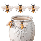 Hand-painted resin bee pot hugger perched on a decorative ceramic vase.