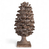 13-inch resin pinecone finial with distressed brown finish on pedestal base
