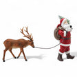 resin Santa figurine leading reindeer, red suit and hand-painted details