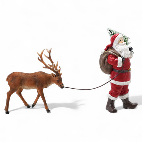 resin Santa figurine leading reindeer, red suit and hand-painted details