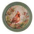 Round framed holiday wall art with red cardinal