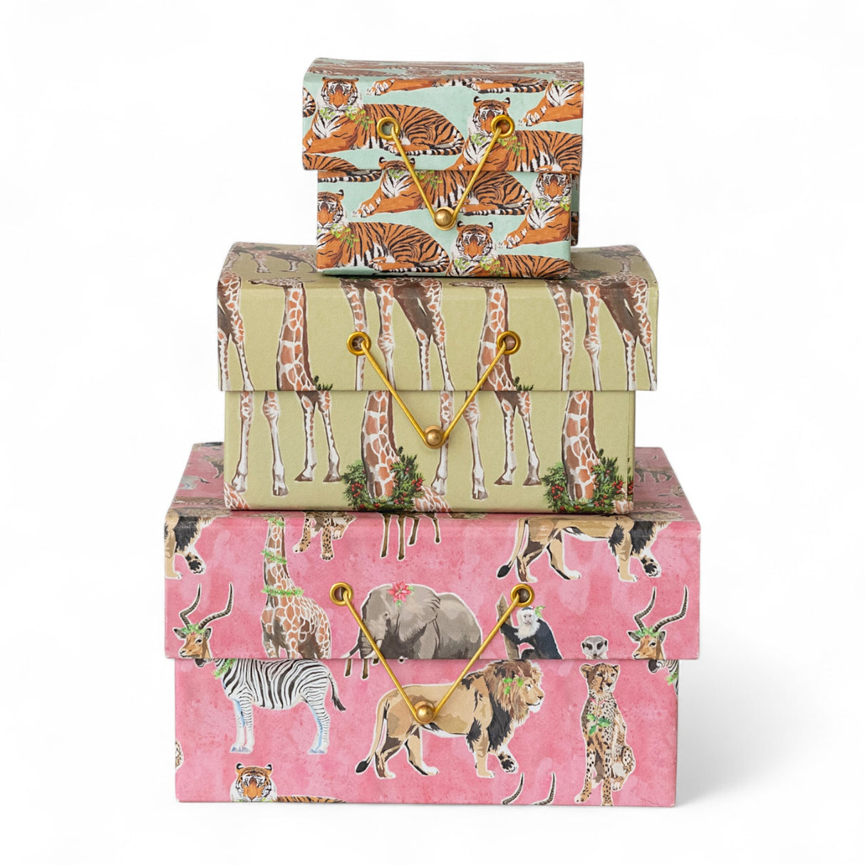 Stack of handmade recycled paper gift boxes with safari animal prints and gold cord closures