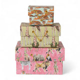 Stack of handmade recycled paper gift boxes with safari animal prints and gold cord closures