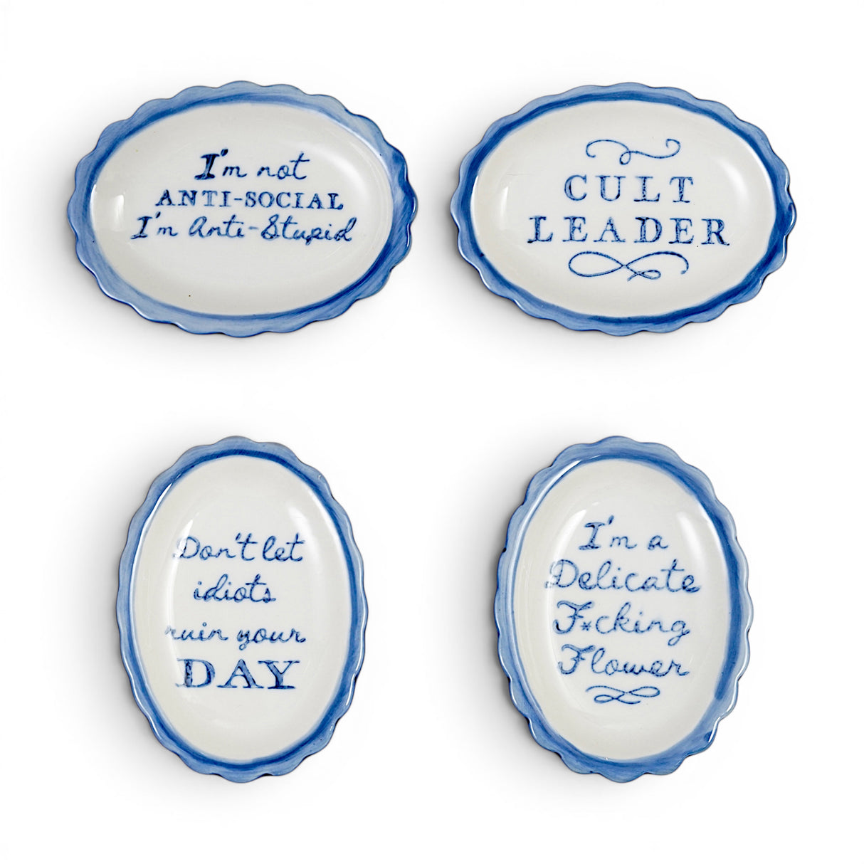 Blue and white scalloped ceramic trinket dishes with funny sayings in four styles