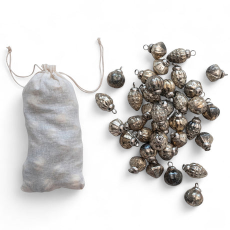 Set of 36 silver embossed mercury glass ornaments with muslin bag