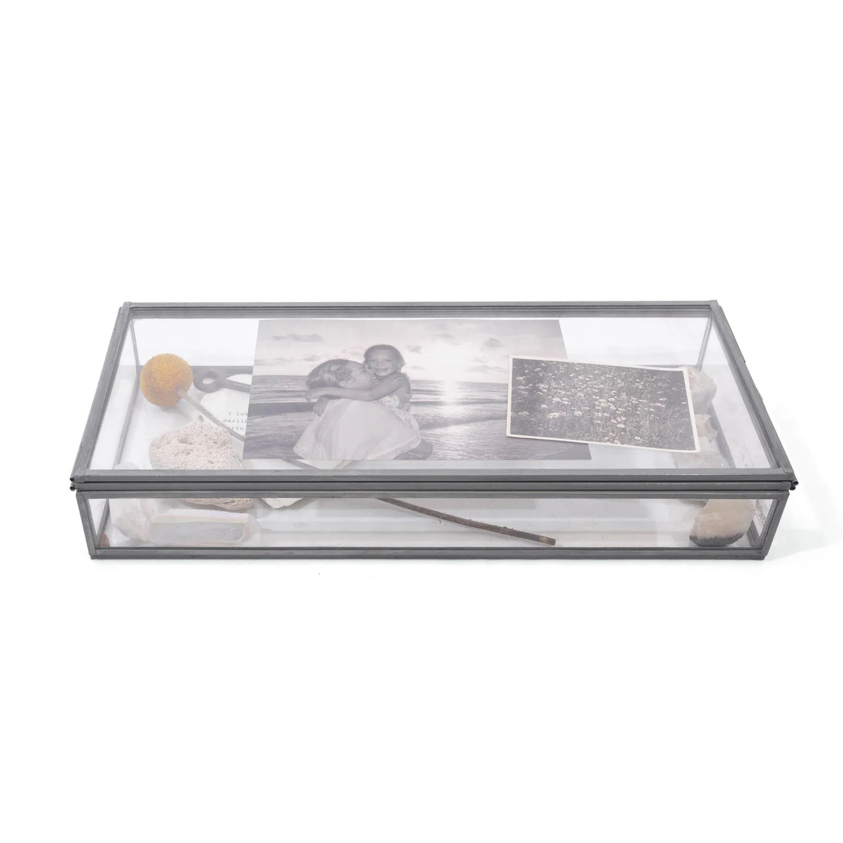 Skinny rectangle glass and zinc memory box measuring 12 by 5 inches, shown filled with photographs and small keepsakes