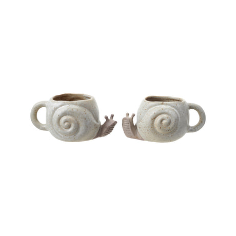 Speckled cream and brown snail-shaped stoneware mug with reactive glaze finish.