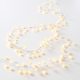 Snowberry plug-in decorative lights with 200 warm white LEDs for indoor and outdoor holiday displays.