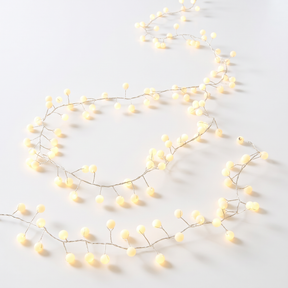 Snowberry plug-in decorative lights with 200 warm white LEDs for indoor and outdoor holiday displays.