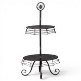 Black metal spider web two-tier Halloween display stand with decorative spider topper