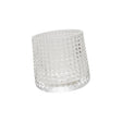 Embossed clear spinning whiskey glass with textured design