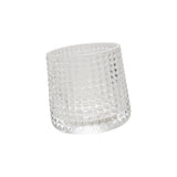 Embossed clear spinning whiskey glass with textured design