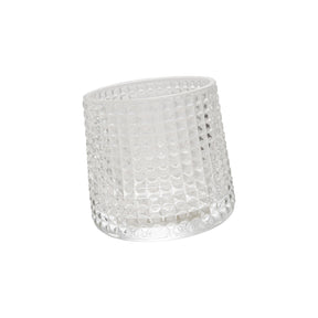 Embossed clear spinning whiskey glass with textured design