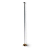 Stainless steel cocktail stirrer with a textured brass bell at one end and a small rounded silver-tone tip at the other.