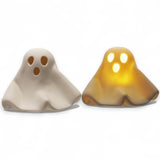 White stoneware ghost with LED light glowing through eyes