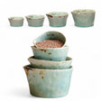 Set of four aqua crackle glaze stoneware measuring cups in 1, 1/2, 1/3, and 1/4 cup sizes
